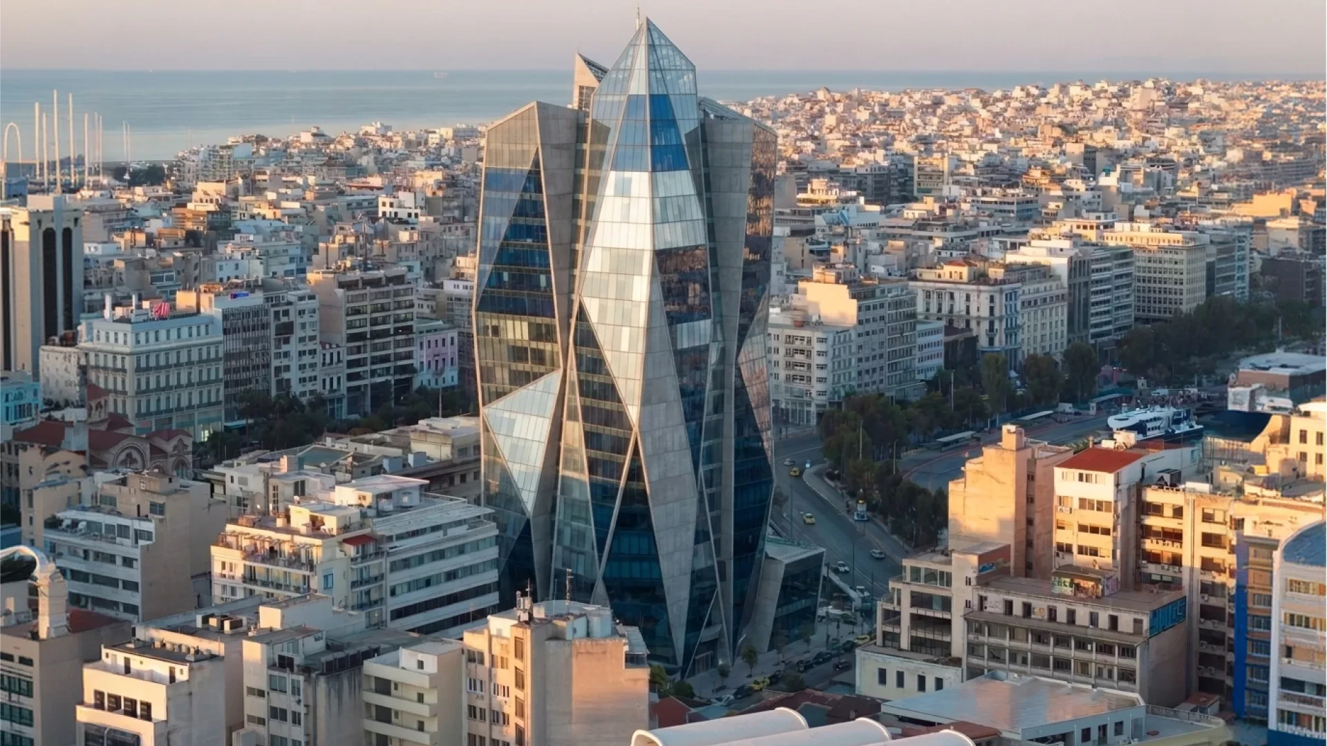 Aerial render of the faceted glass tower in the real city fabric