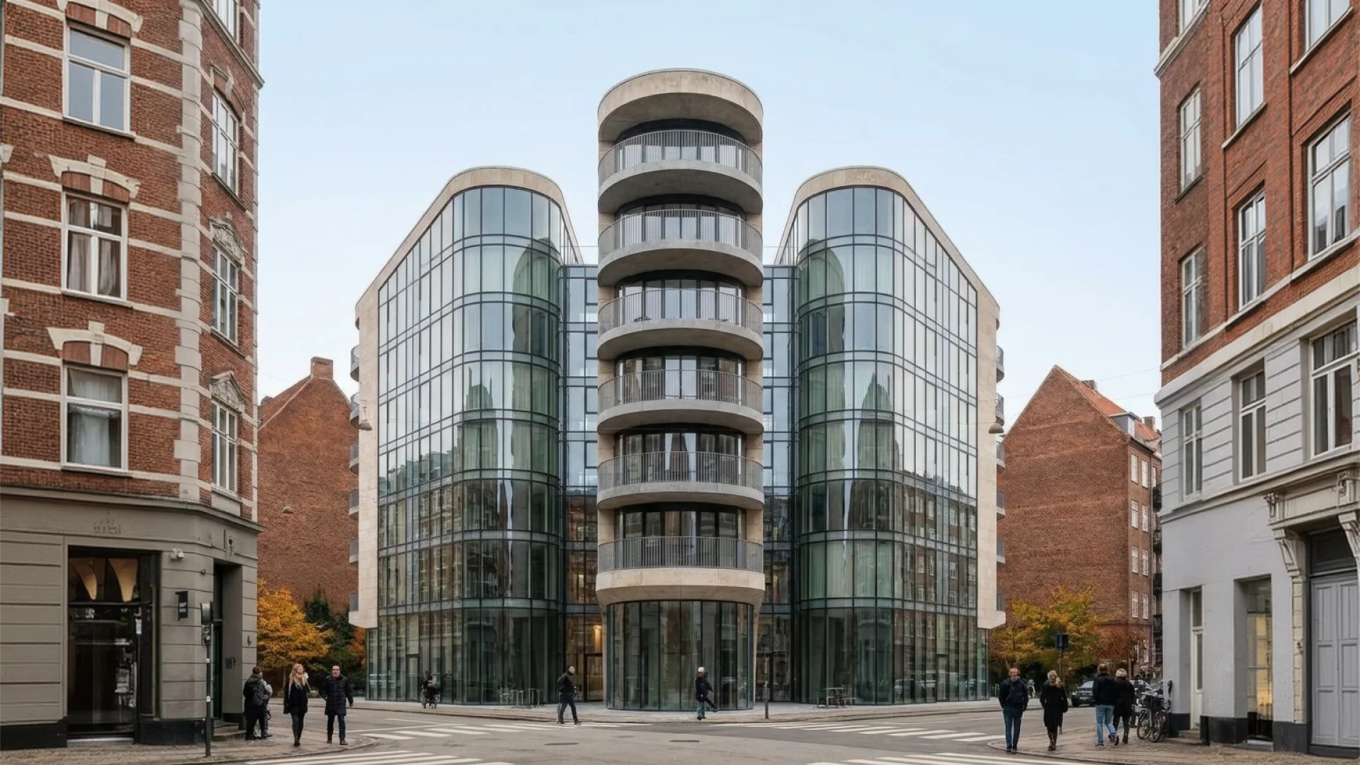 Street view — rounded glass wings and the balconied core above the crossing