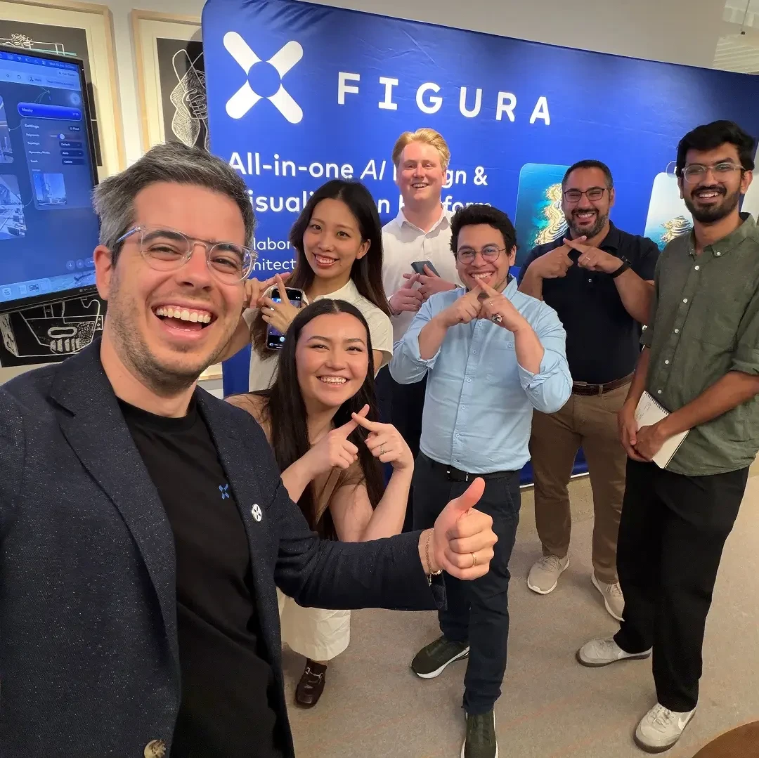 Team photo at Figura event with sign visible behind