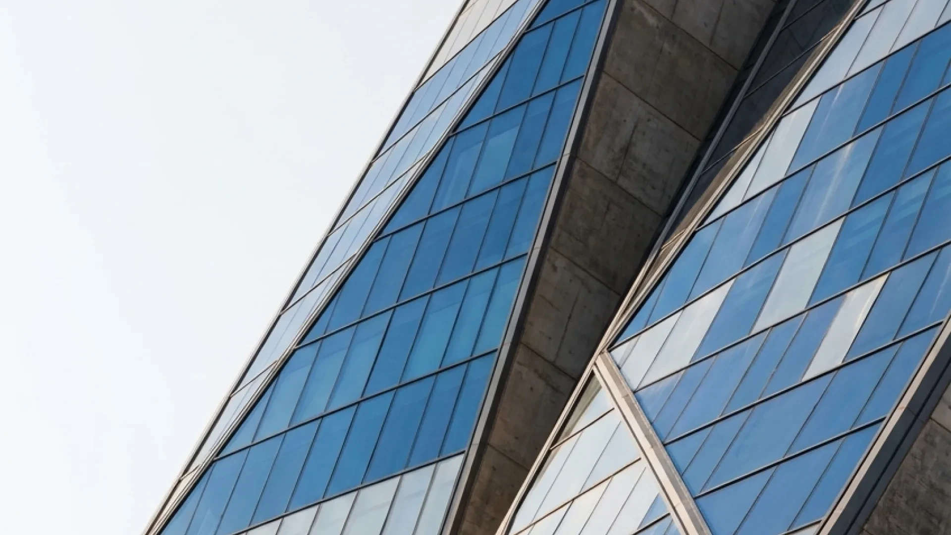 Camera view — the angled curtain-wall facade