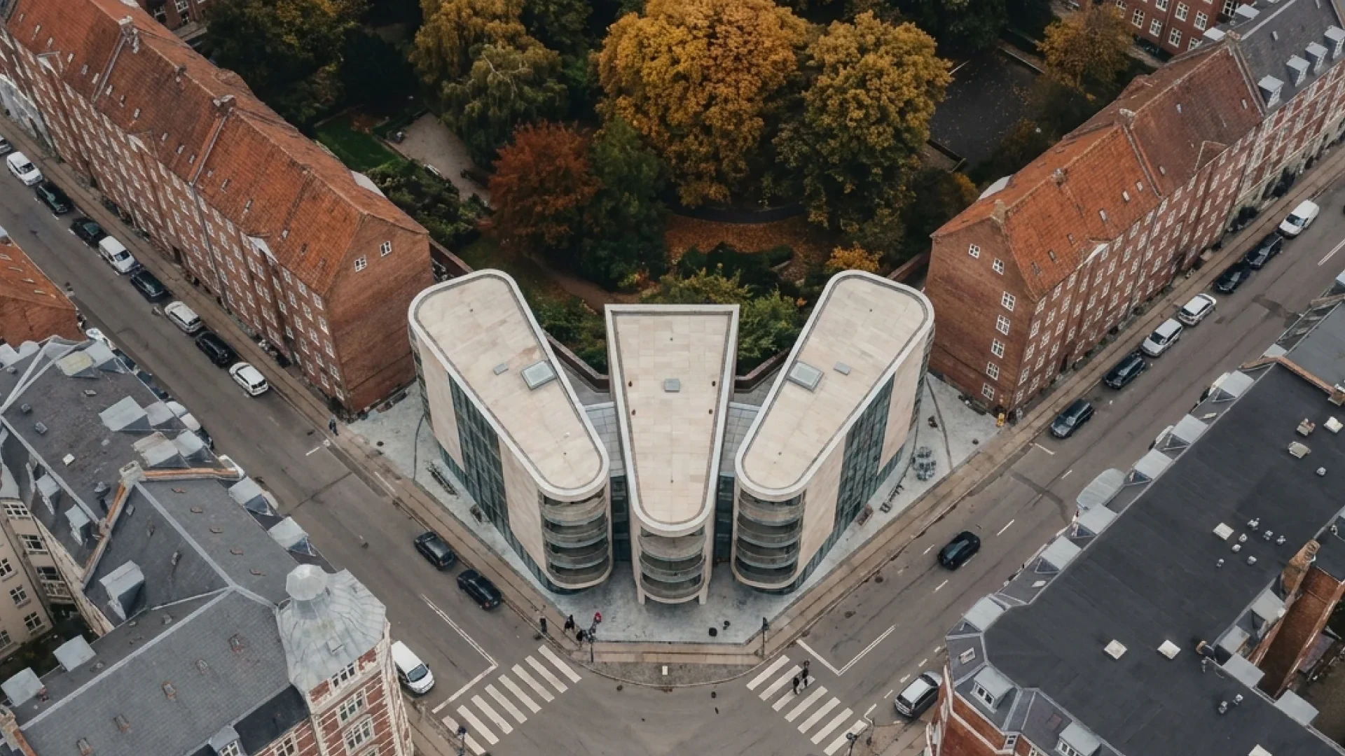 Top-down view — the three wings opening from the courtyard garden to the corner